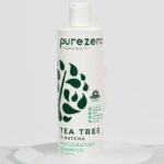 Purezero Tea Tree Matcha Shampoo on a Product Stand