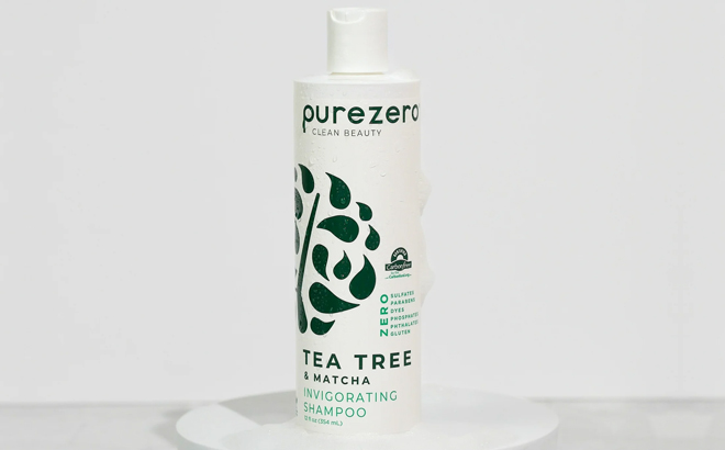 Purezero Tea Tree Matcha Shampoo on a Product Stand