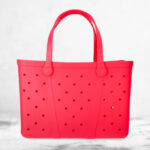 Time and Tru Womens Waterproof EVA Beach Tote Bag in Coral Pink on the Table