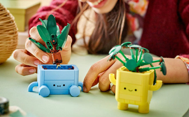 A Person Building LEGO Toy A Person Building LEGO Toy