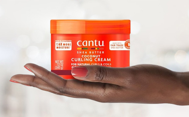 A Person Holding Cantu Coconut Curling Cream with Shea Butter