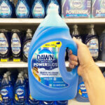 A Person Holding a Dawn Platinum Plus PowerSuds Liquid Dish Soap Refill