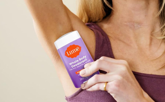 A Person Holding a Lume Whole Body Deodorant A Person Holding a Lume Whole Body Deodorant