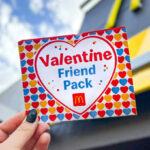 A Person Holding a McDonalds Valentine Friend Coupons Pack