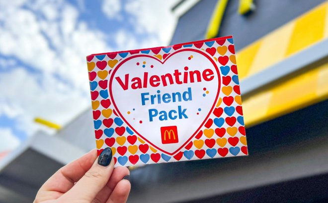 A Person Holding a McDonalds Valentine Friend Coupons Pack