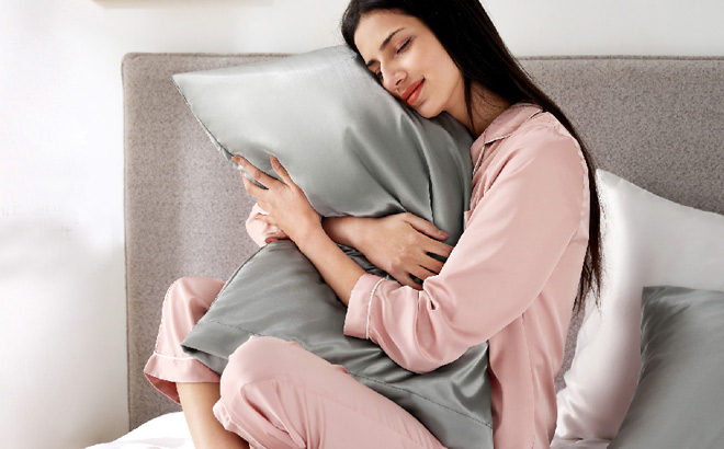A Person Holding a Pillow with Bedsure Satin Pillowcase
