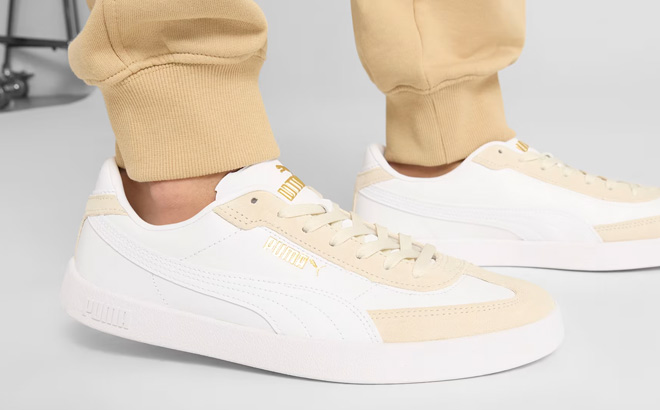 A Person Wearing Puma Club II Era Womens Shoes in White Vapor Gray