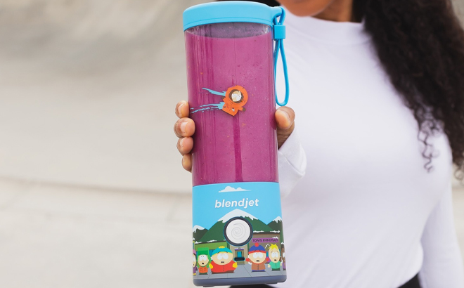 A Woman Holding BlendJet 2 South Park Portable Blender