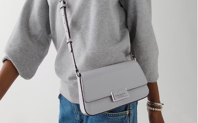 A Woman Wearing Kate Spade Reegan Patent Mini Flap Crossbody