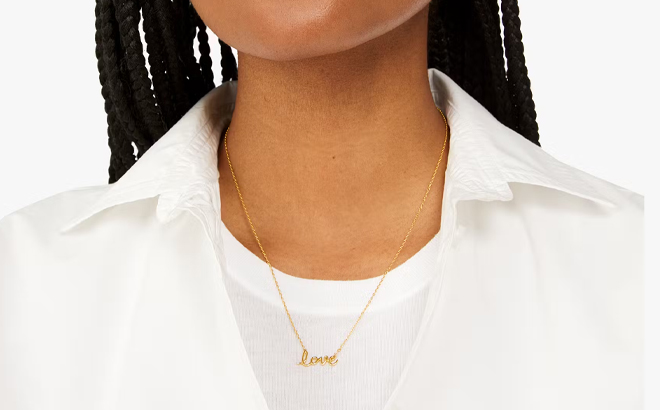 A Woman Wearing Kate Spade Say Yes Love Pendant A Woman Wearing Kate Spade Say Yes Love Pendant