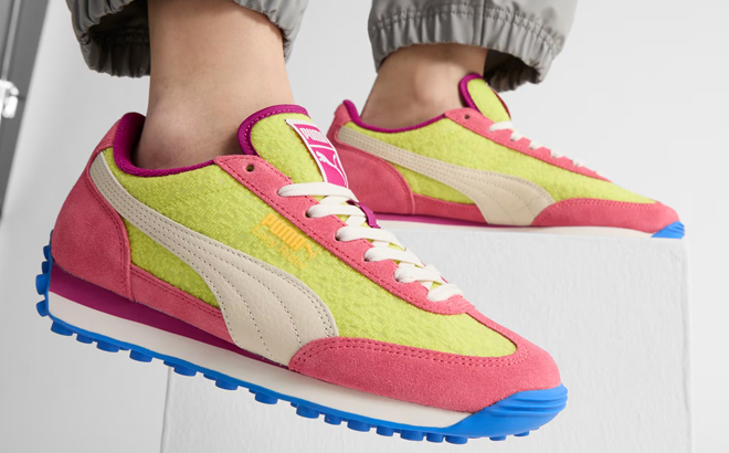 A Woman Wearing Puma Easy Rider Brights Sneakers