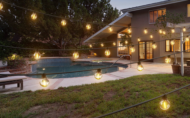 Addlon 100 Foot Outdoor Solar String Lights in a Backyard