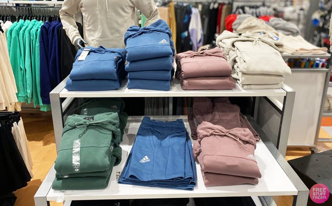 Clothes on a Shelf inside Adidas Store