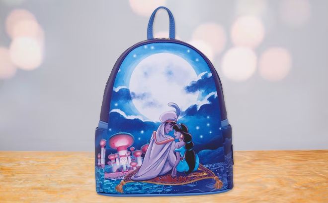 Loungefly Disney Aladdin Magic Carpet Ride Mini Backpack on a Tabletop