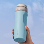 Person Holding Carote Water Bottle