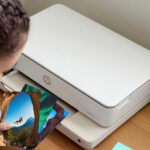 A Girl Using the HP Envy 6155e All In One Printer