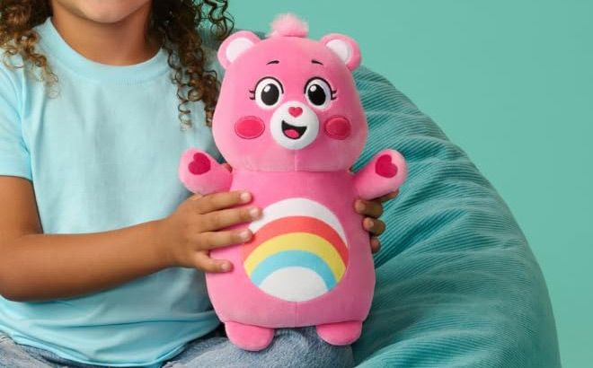 A Kid Holding Squishmallows 10 Inch Original Care Bear A Kid Holding Squishmallows 10 Inch Original Care Bear