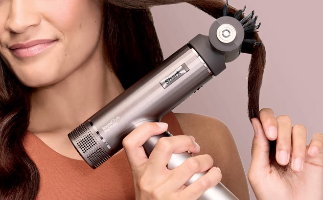 A Person Holding Shark SpeedStyle Pro Flex Professional Performance High Velocity Hair Dryer System