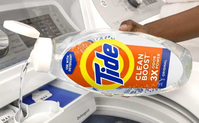 A Person Holding Tide Deep Cleansing Fabric Rinse