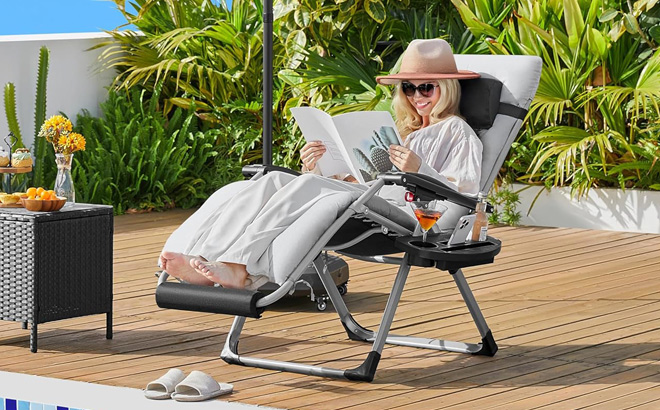 A Person Sitting on a Yaheetech Zero Gravity Chair A Person Sitting on a Yaheetech Zero Gravity Chair