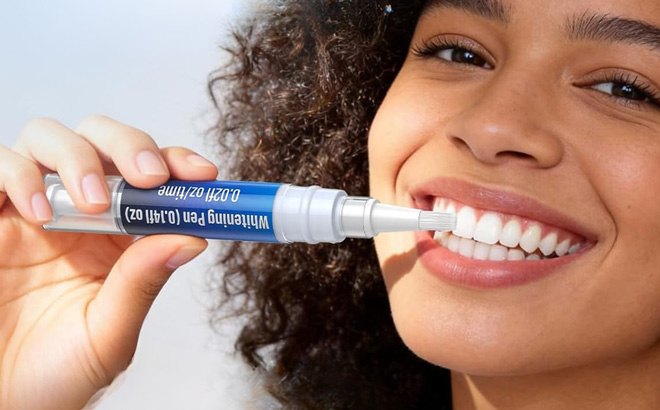 A Person Using a Selfea Teeth Whitening Pen