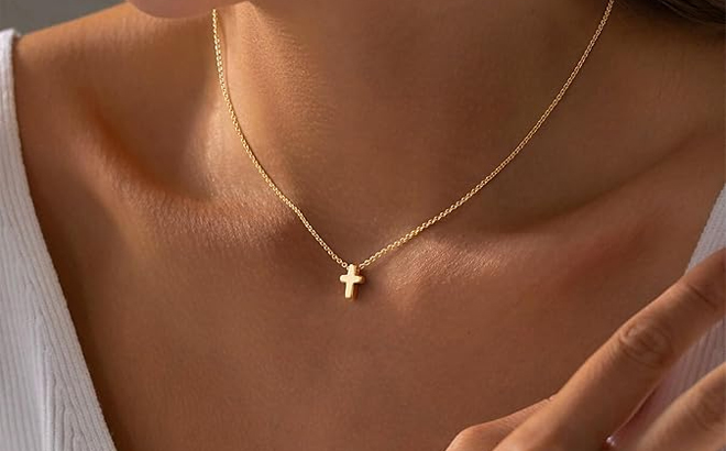 A Person Wearing the Dainty 14K Real Gold Plated Cross Pendant Necklace