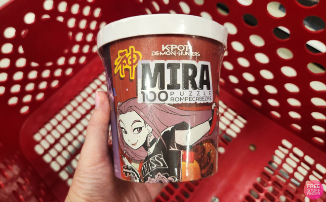 A Woman Holding Buffalo Games K Pop Demon Hunters Ramen Noodle Mira 100 Piece Puzzle