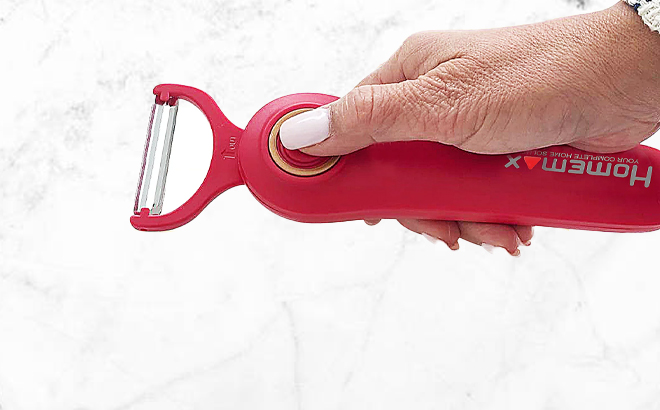A Woman Holding the Homemax Cordless Electric Peeler A Woman Holding the Homemax Cordless Electric Peeler