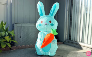 Airblown Blue Bunny Holding a Carrot