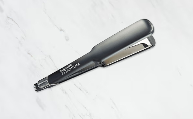 BaBylissPRO Titanium Flat Iron 1 5 Inch on a Marble Tabletop