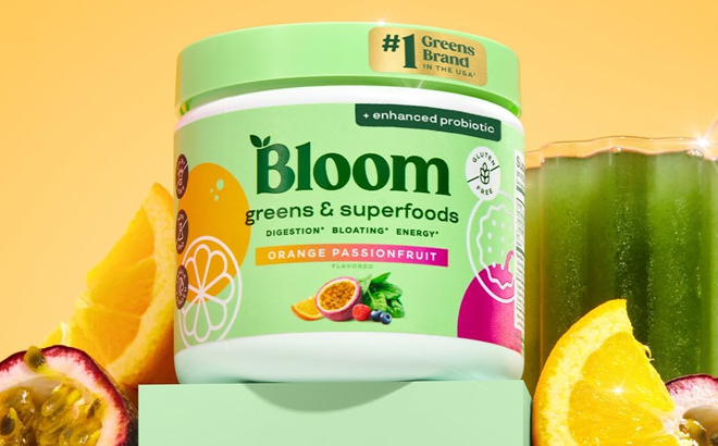 Bloom Nutrition Greens Superfoods Powder on a Product Stand