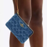 Coach Outlet Corner Zip Wristlet In Signature Denim