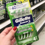 A Person Holding Gillette Sensor3 Sensitive 3 Blade Disposable Razors
