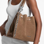 A Person Holding Michael Kors Mina Large Suede Chain Shoulder Bag