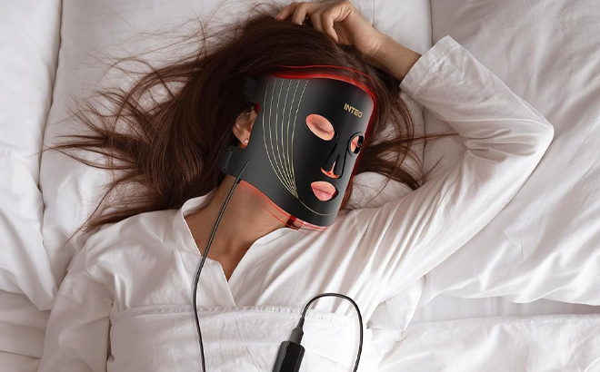 A Person Using the INTEO Red Light Therapy Mask for Face