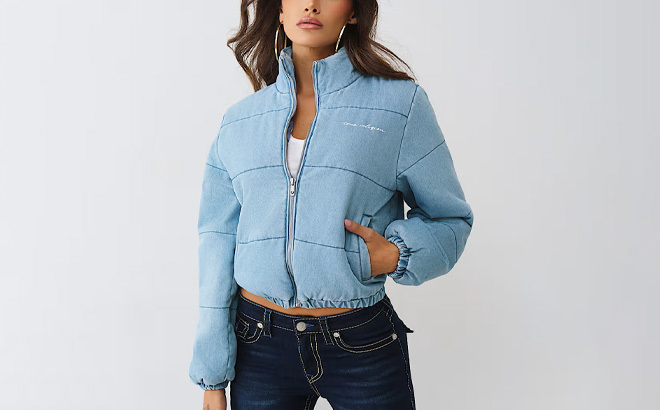 A Person Wearing True Religion Denim Logo Script Puffer Jacket