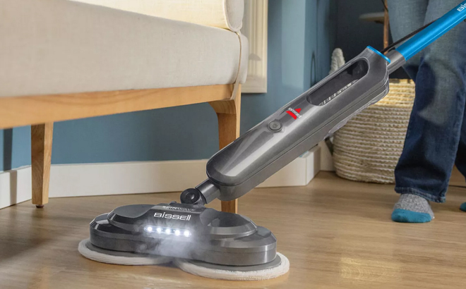 A Woman Cleaning with the Bissell SpinWave SmartSteam Spin Mop