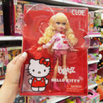 A Woman Holding Bratz x Hello Kitty Cloe Sanrio Fashion Doll with Accessories