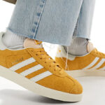 A Woman Wearing Adidas Originals Gazelle Shoes