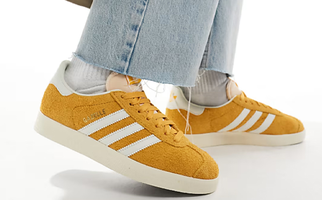 A Woman Wearing Adidas Originals Gazelle Shoes