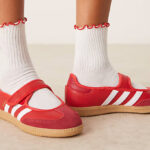 A Woman Wearing Adidas Originals Samba Jane Shoes in Better Scarlet