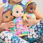 A Kid Holding Baby Alive Soft ‘n Cute Dolls