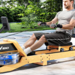 A Man Using the Merach Foldable Rowing Machine