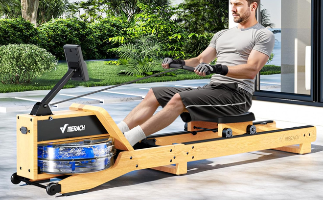 A Man Using the Merach Foldable Rowing Machine