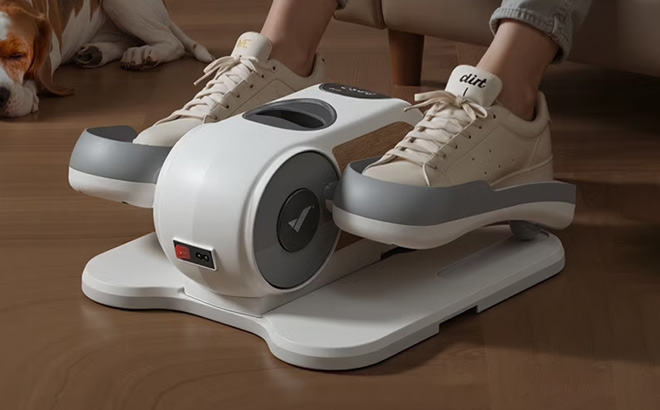 A Person Using Merach Under Desk Elliptical Machine