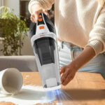 A Woman Using the BRL Cordless Handheld Vacuum