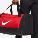 A Person Holding Nike Mens Brasilia Training Duffel Bag
