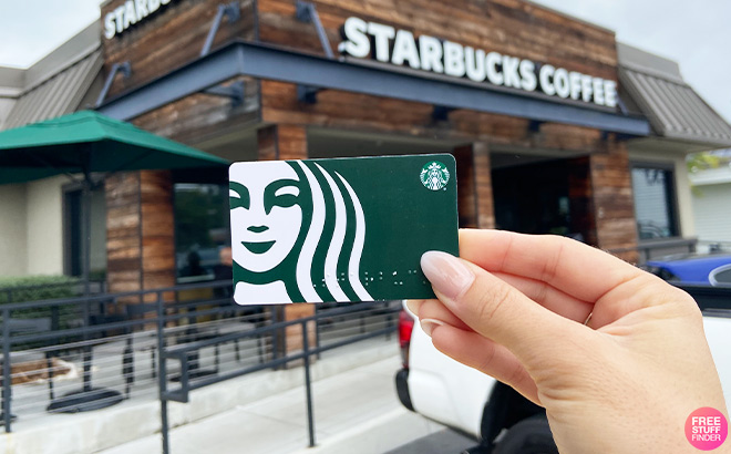 A Person Holding Starbucks Gift Card Storefront