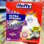 A Person Holding a Box of Hefty Ultra Strong Trash Bags