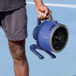A Person Holding a Shark FlexBreeze Portable Fan
